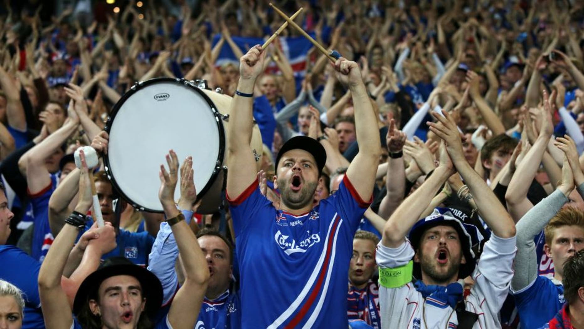 PARIS, FRANCE - JULY 03: Iceland supporters salute their team at full time after the UEFA Euro 2016 quarter final match between France and Iceland at Stade de France on July 3, 2016 in Paris, France. (Photo by Matthew Ashton - AMA/Getty Images)