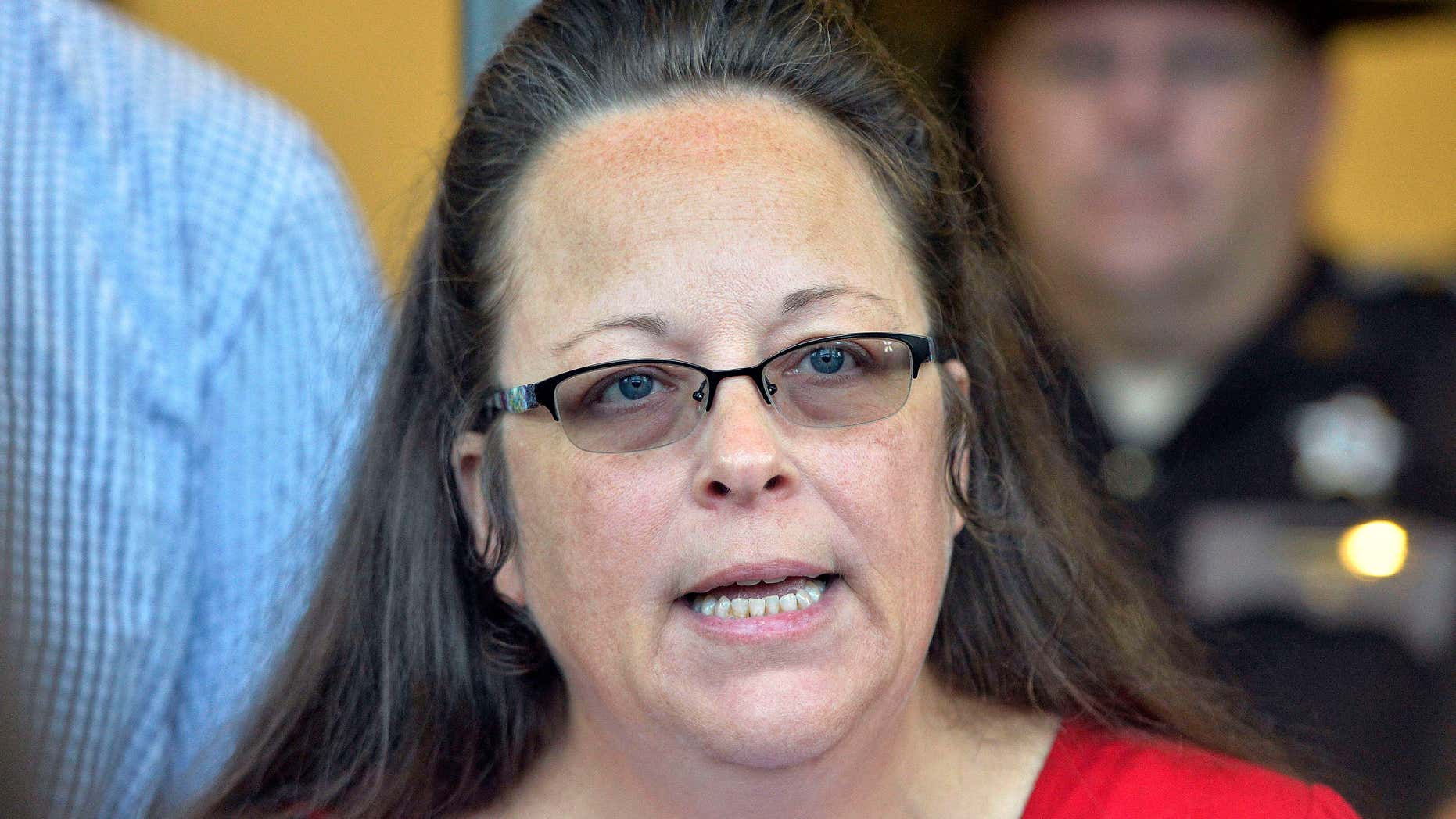 FILE - In this Sept. 14, 2015, file photo, Rowan County Clerk Kim Davis makes a statement to the media at the front door of the Rowan County Judicial Center in Morehead, Ky.