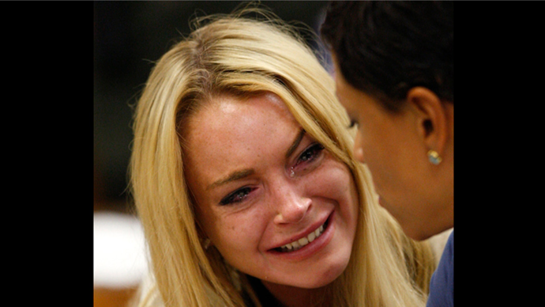 July 6: Actress Lindsay Lohan reacts after the sentencing by Superior Court Judge Marsha Reve during a hearing in Beverly Hills, Calif.
