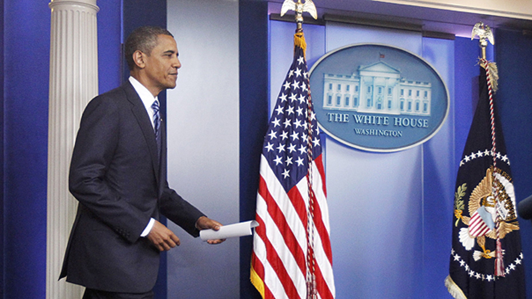 July 5: Obama arrives in the James Brady Press Briefing Room of the White House in Washington to make a statement to reporters about debt ceiling negotiations.