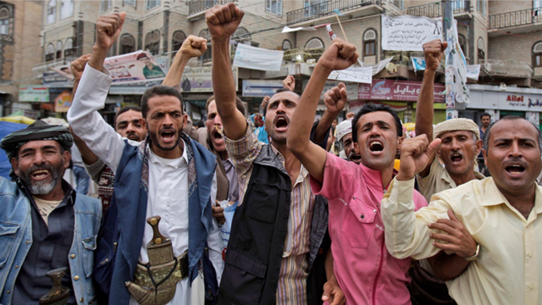 July 5: Anti-government protestors shout slogans during a demonstration demanding the resignation of Yemeni President Ali Abdullah Saleh in Sanaa, Yemen.