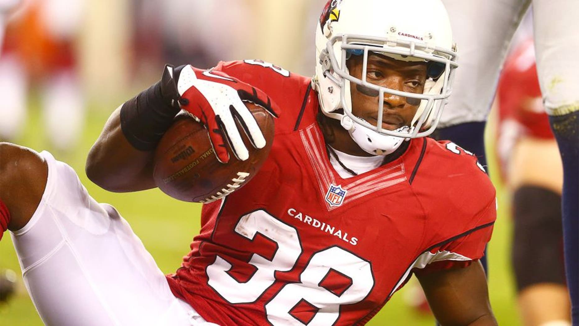 Oct 17, 2013; Phoenix, AZ, USA; Arizona Cardinals running back Andre Ellington (38) against the Seattle Seahawks at University of Phoenix Stadium. Mandatory Credit: Mark J. Rebilas-USA TODAY Sports