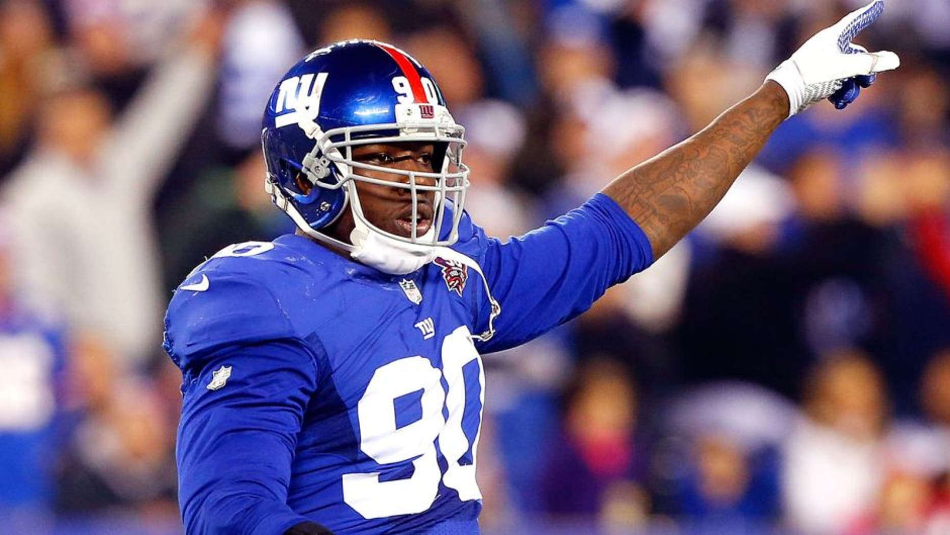 EAST RUTHERFORD, NJ - NOVEMBER 23: (NEW YORK DAILIES OUT) Jason Pierre-Paul #90 of the New York Giants in action against the Dallas Cowboys on November 23, 2014 at MetLife Stadium in East Rutherford, New Jersey. The Cowboys defeated the Giants 31-28. (Photo by Jim McIsaac/Getty Images)