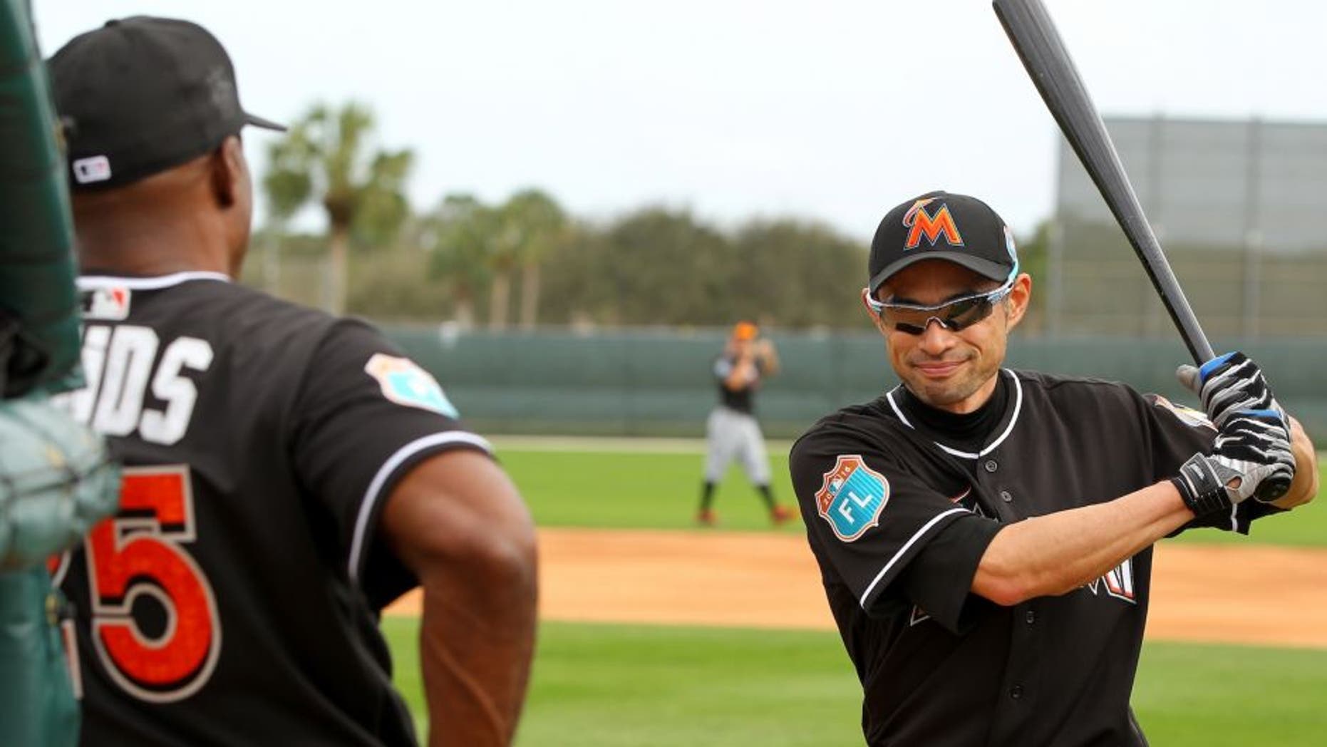 JUPITER, FL - FEBRUARY 23: Ichiro Suzuki #51 talks with new Marlins hitting coach Barry Bonds #25 during a Miami Marlins workout on February 23, 2016 in Jupiter, Florida. (Photo by Rob Foldy/Getty Images)
