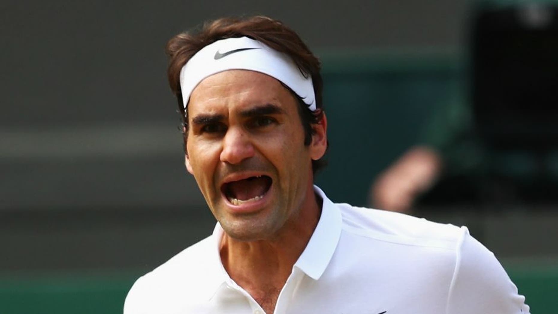 LONDON, ENGLAND - JULY 06: Roger Federer of Switzerland celebrates during the Men's Singles Quarter Finals match against Marin Cilic of Croatia on day nine of the Wimbledon Lawn Tennis Championships at the All England Lawn Tennis and Croquet Club on July 6, 2016 in London, England. (Photo by Clive Brunskill/Getty Images)