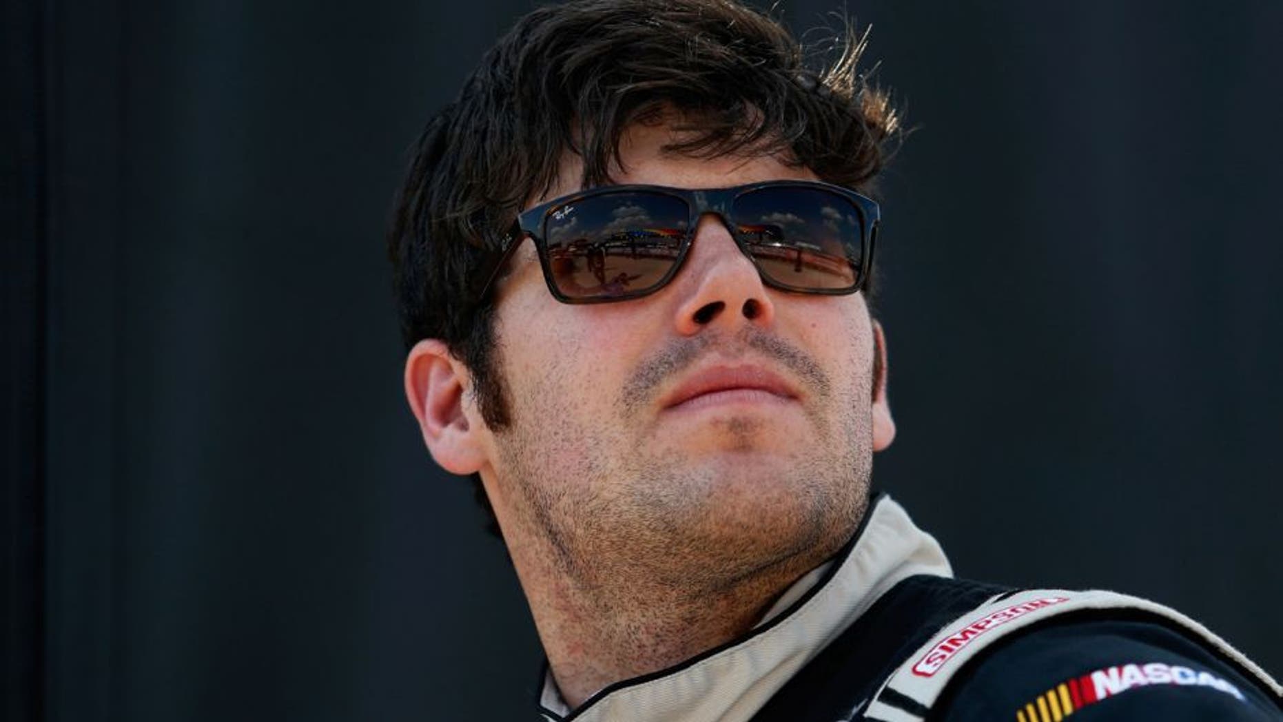 FORT WORTH, TX - JUNE 10: John Wes Townley, driver of the #05 Jive Communications/Zaxbys Chevrolet, stands on the grid during Star-Telegram Qualifying for the NASCAR Camping World Truck Series Rattlesnake 400 at Texas Motor Speedway on June 10, 2016 in Fort Worth, Texas. (Photo by Matt Hazlett/Getty Images for Texas Motor Speedway)