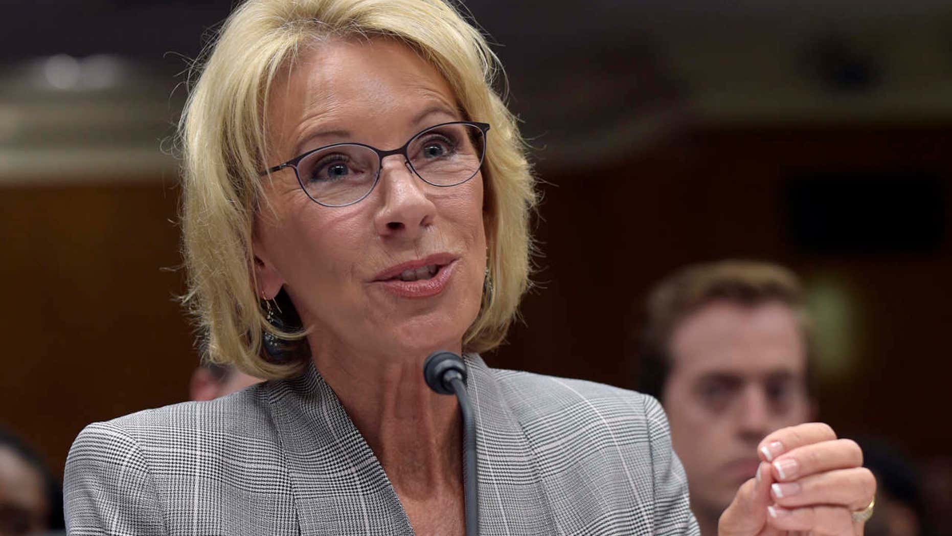 FILE - In this June 6, 2017, file photo, Education Secretary Betsy DeVos testifies on Capitol Hill in Washington before the Senate Appropriations Committee, Labor, Health and Human Services, Education, and Related Agencies Subcommittee hearing on the fiscal year 2018 budget.