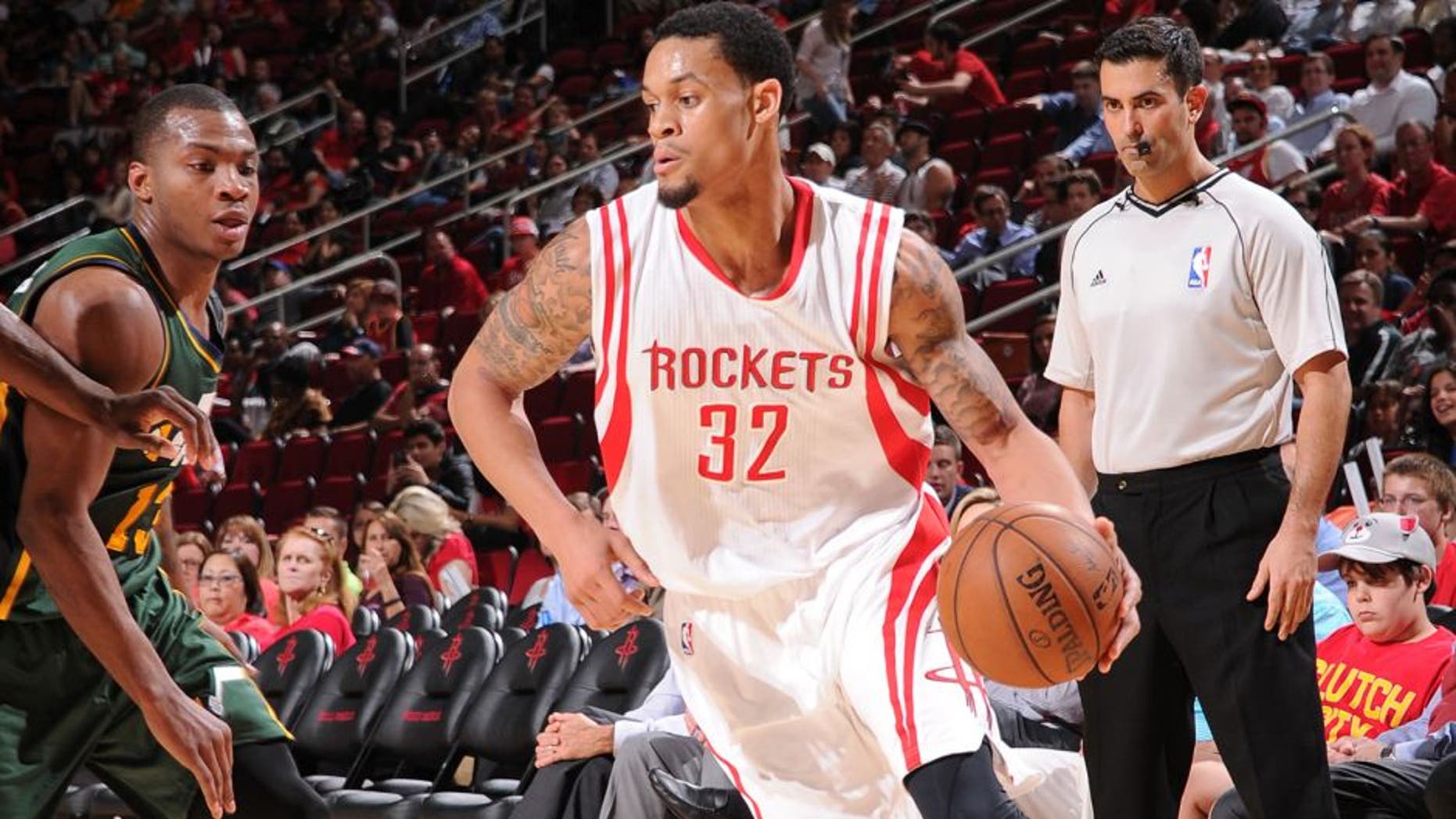 HOUSTON, TX - APRIL 15: K.J. McDaniels #32 of the Houston Rockets handles the ball against the Utah Jazz on April 15, 2015 at the Toyota Center in Houston, Texas. NOTE TO USER: User expressly acknowledges and agrees that, by downloading and or using this photograph, User is consenting to the terms and conditions of the Getty Images License Agreement. Mandatory Copyright Notice: Copyright 2015 NBAE (Photo by Bill Baptist/NBAE via Getty Images)