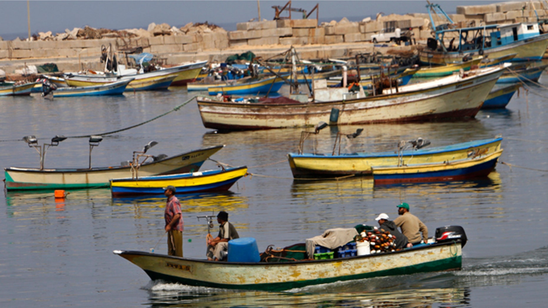 July 7: Palestinian fishermen arrive with their boat at the port of Gaza City.