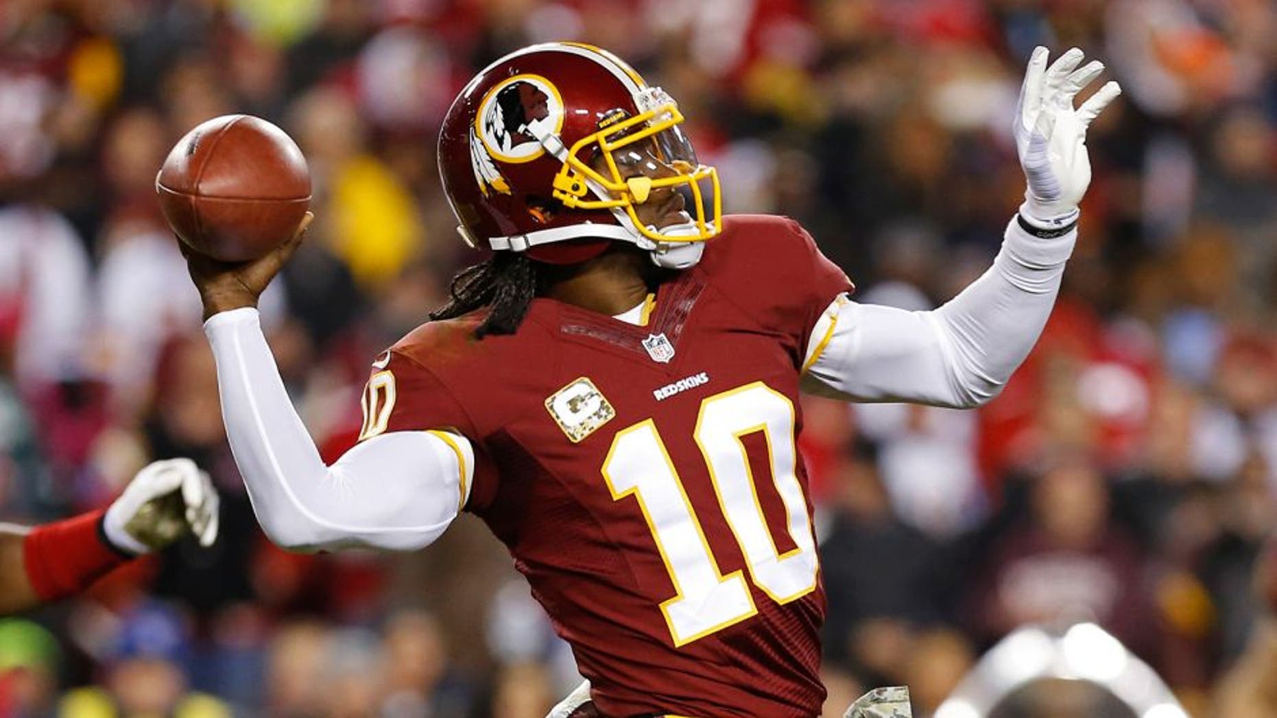 Nov 25, 2013; Landover, MD, USA; Washington Redskins quarterback Robert Griffin III (10) throws the ball against the San Francisco 49ers at FedEx Field. Mandatory Credit: Geoff Burke-USA TODAY Sports