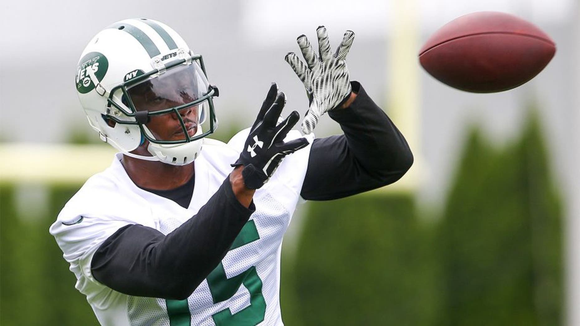 May 27, 2015; East Rutherford, NJ, USA; New York Jets wide receiver Brandon Marshall (15) catches a pass during organized team activities at Atlantic Health Jets Training Center. Mandatory Credit: Ed Mulholland-USA TODAY Sports