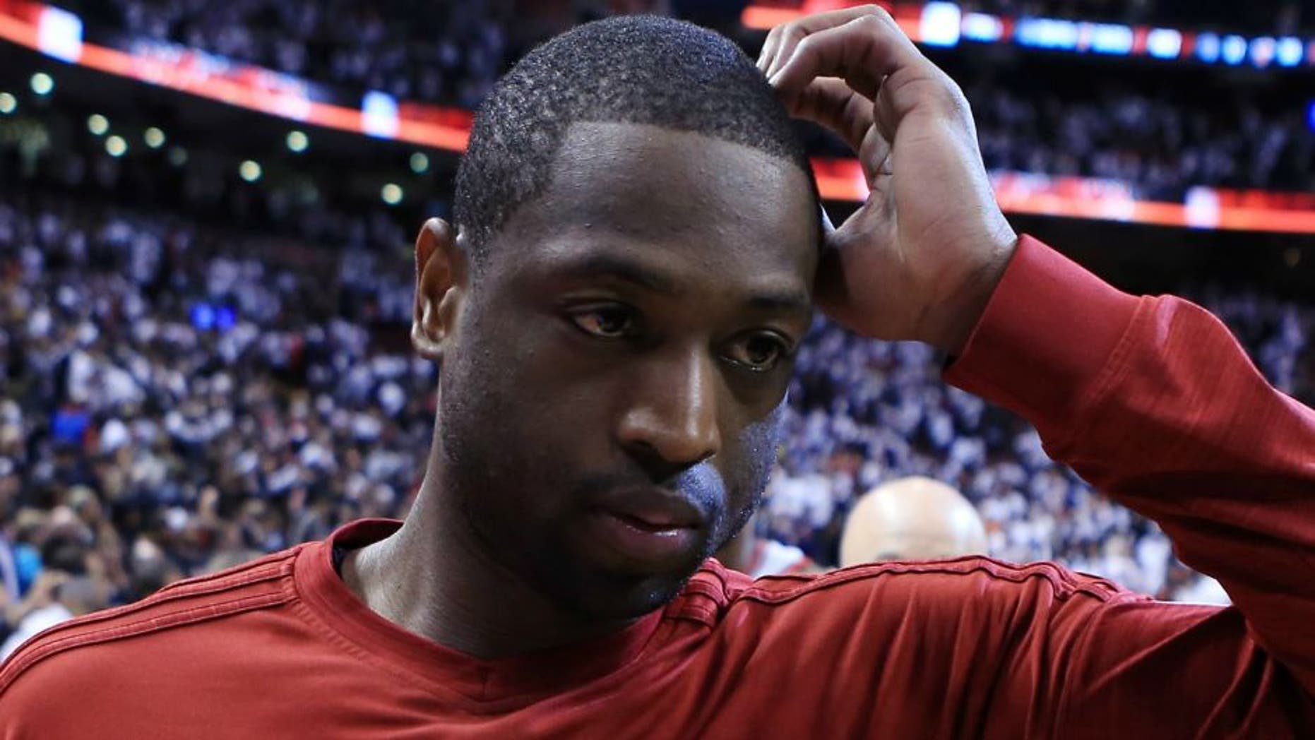 TORONTO, ON - MAY 15: Dwyane Wade #3 of the Miami Heat walks off the court following Game Seven of the Eastern Conference Quarterfinals against the Toronto Raptors during the 2016 NBA Playoffs at the Air Canada Centre on May 15, 2016 in Toronto, Ontario, Canada. NOTE TO USER: User expressly acknowledges and agrees that, by downloading and or using this photograph, User is consenting to the terms and conditions of the Getty Images License Agreement. (Photo by Vaughn Ridley/Getty Images)