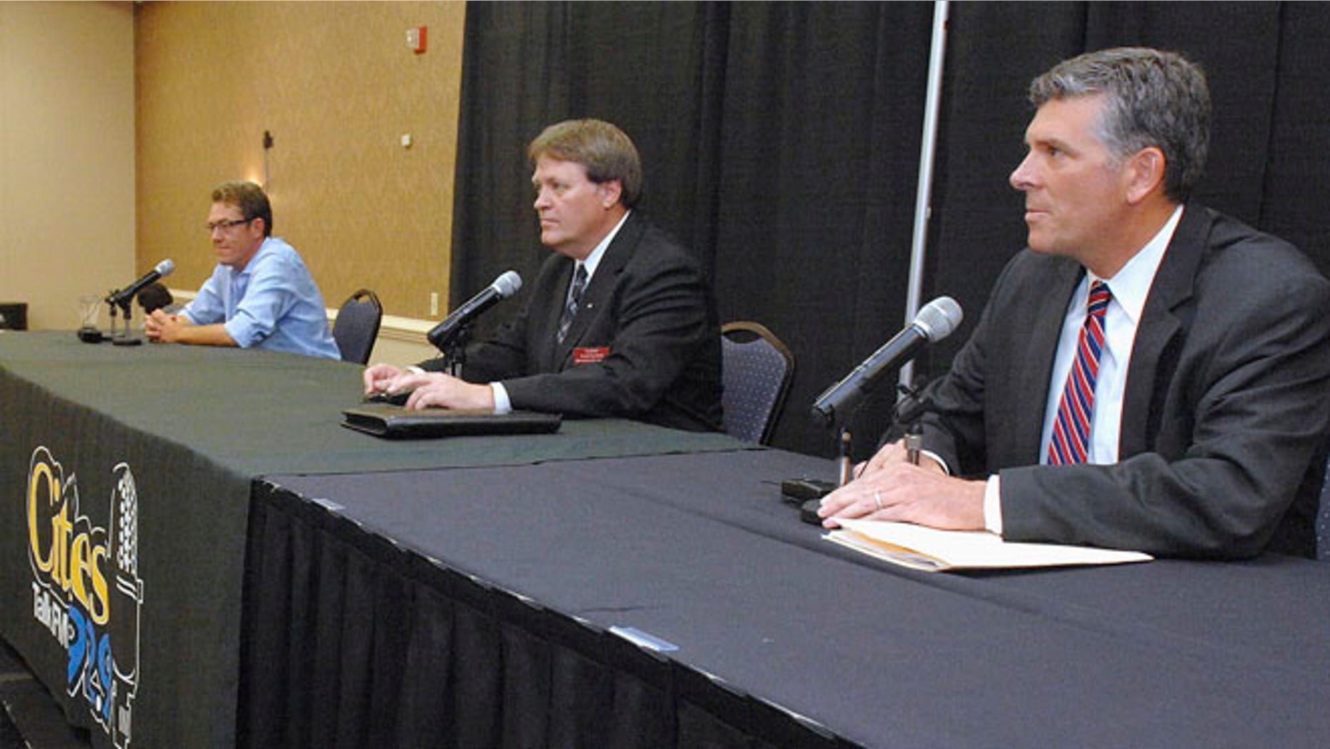 June 24, 2015: Republican candidates in a primary to fill Illinois 18th District seat from left, Michael Flynn, Donald Rients and Illinois state Sen. Darin LaHood prepare for a debate in Bloomington, Ill.