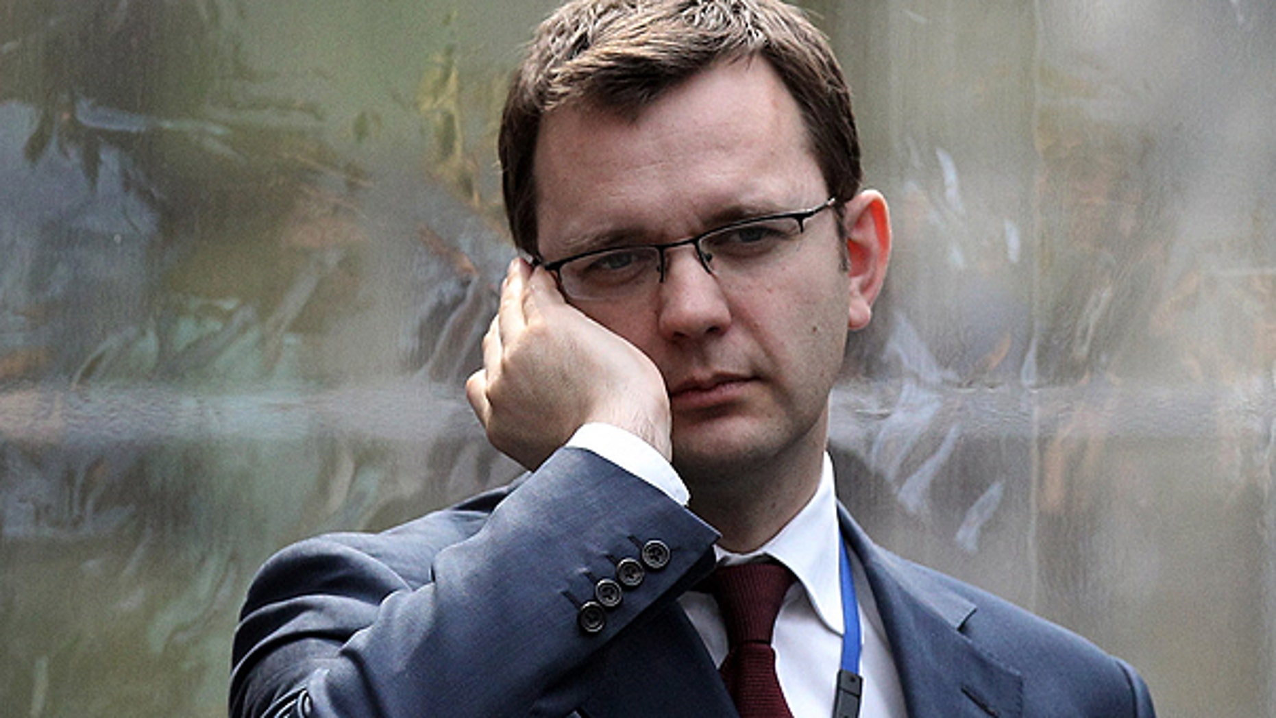 Andy Coulson, formerly editor of the tabloid News of the World, and later David Cameron's director of communications, speaks on a mobile phone in London, in this April 13, 2010, file photo.