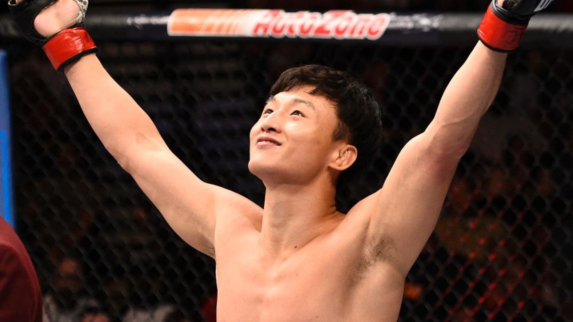 LAS VEGAS, NV - JULY 08: Doo Ho Choi of South Korea celebrates after his knockout victory over Thiago Tavares of Brazil in their featherweight bout during The Ultimate Fighter Finale event at MGM Grand Garden Arena on July 8, 2016 in Las Vegas, Nevada. (Photo by Jeff Bottari/Zuffa LLC/Zuffa LLC via Getty Images)
