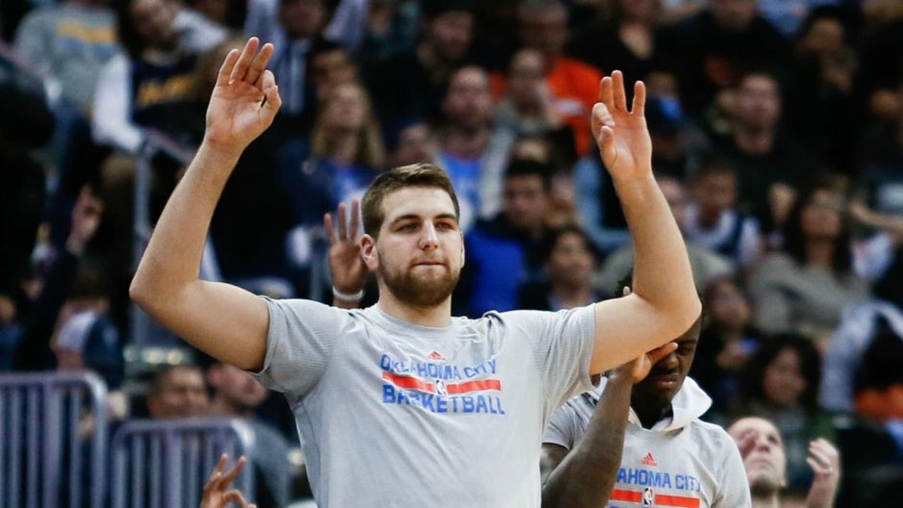 Jan 19, 2016; Denver, CO, USA; Oklahoma City Thunder forward Mitch McGary (33) reacts to a play from the bench in the fourth quarter against the Denver Nuggets at the Pepsi Center. Mandatory Credit: Isaiah J. Downing-USA TODAY Sports