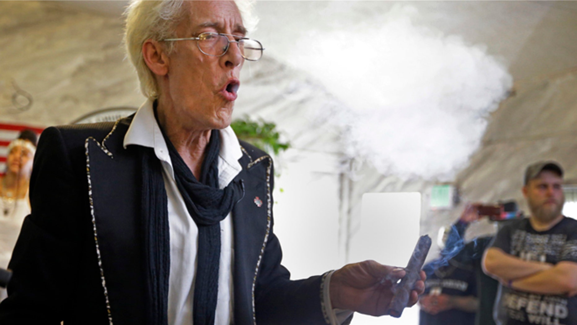 July 1, 2015: First Church of Cannabis Founder Bill Levin exhales as he smokes a "sacrament substitute" during the church's first service in Indianapolis.