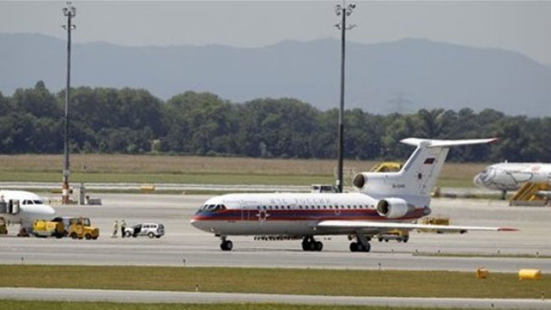 July 9: A Russian plane believed to be carrying candidates for a 14-person spy swap as part of the largest spy swap since the Cold War is parked on the tarmac at Vienna's Schwechat airport (AP).