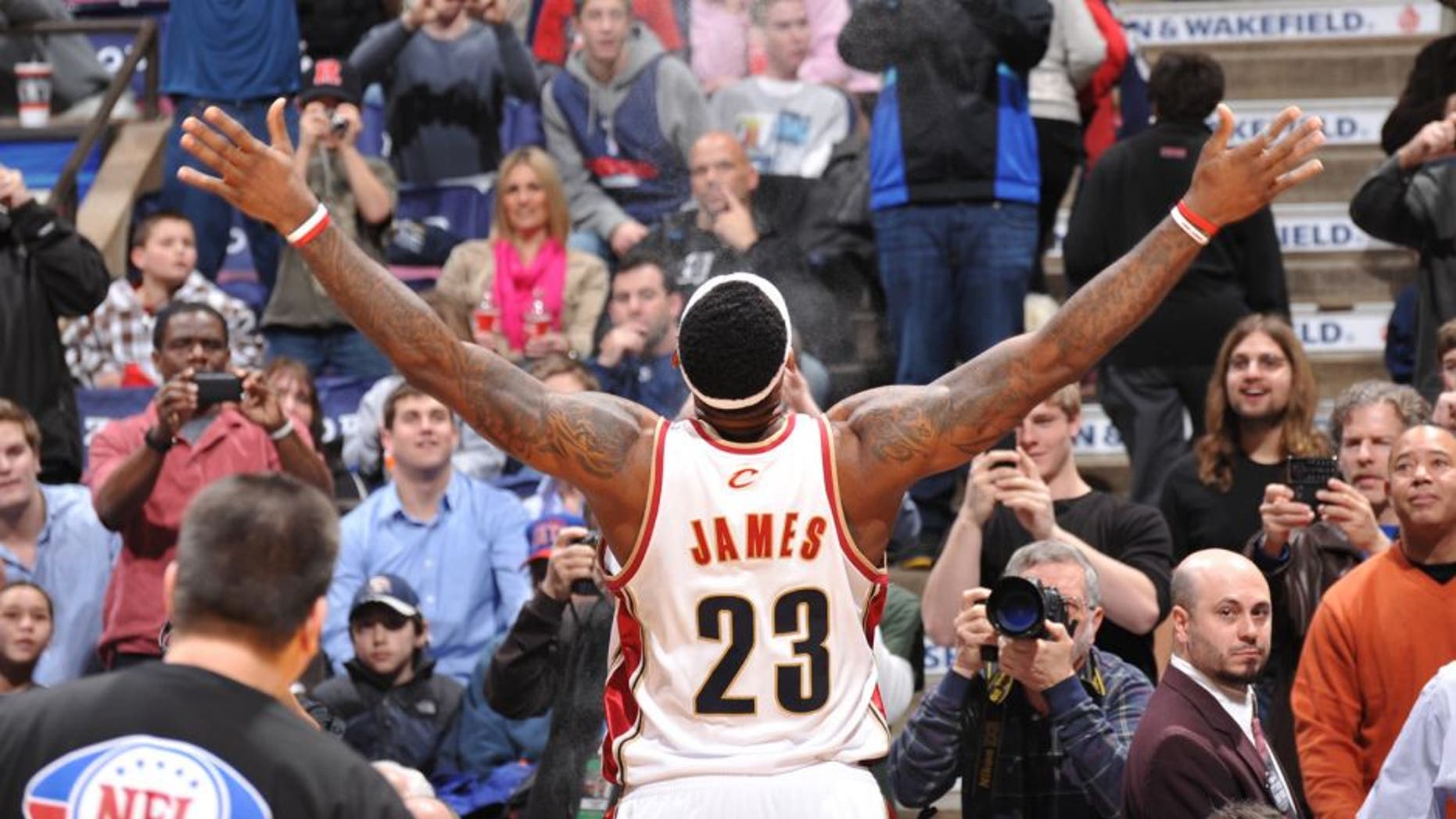EAST RUTHERFORD, NJ - JANUARY 2: LeBron James #23 of the Cleveland Cavaliers performs his pre-game ritual with chalk powder before a game against the New Jersey Nets on January 2, 2010 at the Izod Center in East Rutherford, New Jersey. NOTE TO USER: User expressly acknowledges and agrees that, by downloading and/or using this Photograph, user is consenting to the terms and conditions of the Getty Images License Agreement. Mandatory Copyright Notice: Copyright 2010 NBAE (Photo by Jesse D. Garrabrant/NBAE via Getty Images) *** Local Caption *** LeBron James