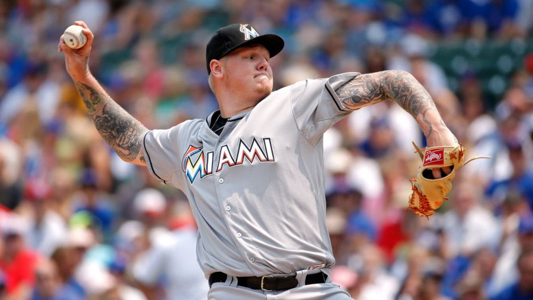 CHICAGO, IL - JULY 05: Mat Latos #35 of the Miami Marlins pitches against the Chicago Cubs during the first inning at Wrigley Field on July 5, 2015 in Chicago, Illinois. (Photo by Jon Durr/Getty Images)