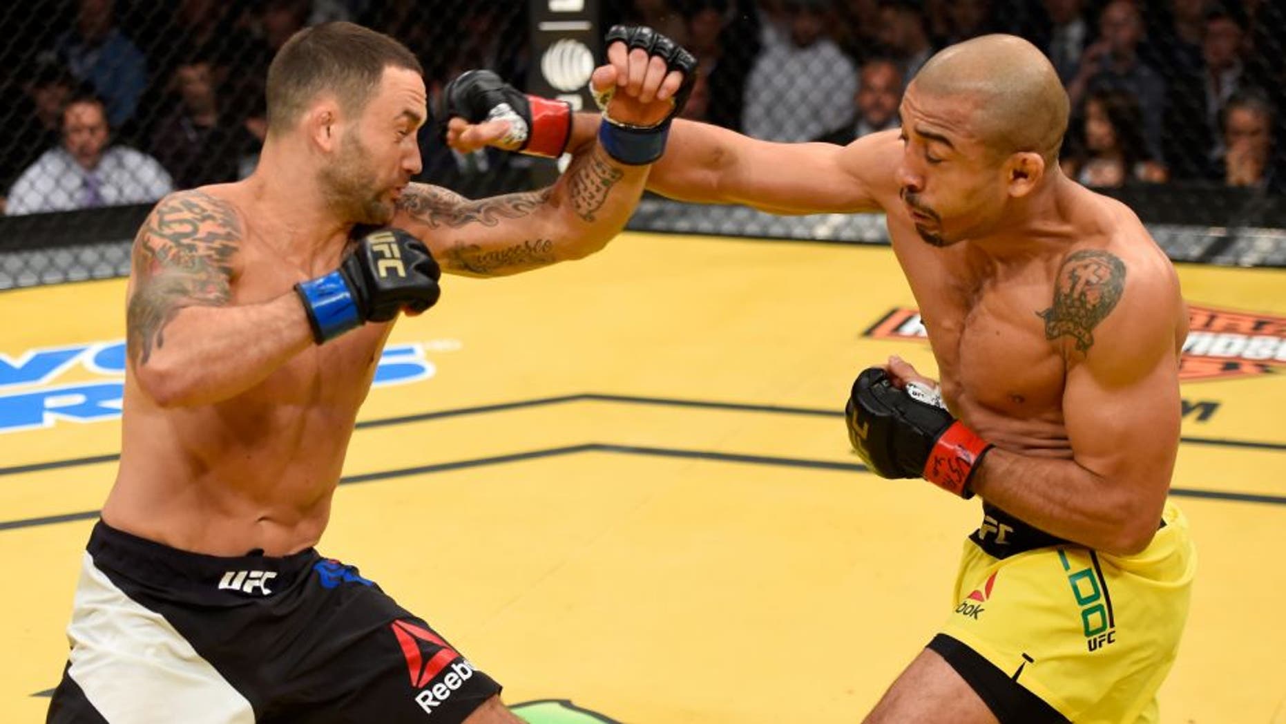LAS VEGAS, NV - JULY 09: (R-L) Jose Aldo of Brazil punches Frankie Edgar in their UFC interim featherweight championship bout during the UFC 200 event on July 9, 2016 at T-Mobile Arena in Las Vegas, Nevada. (Photo by Josh Hedges/Zuffa LLC/Zuffa LLC via Getty Images)