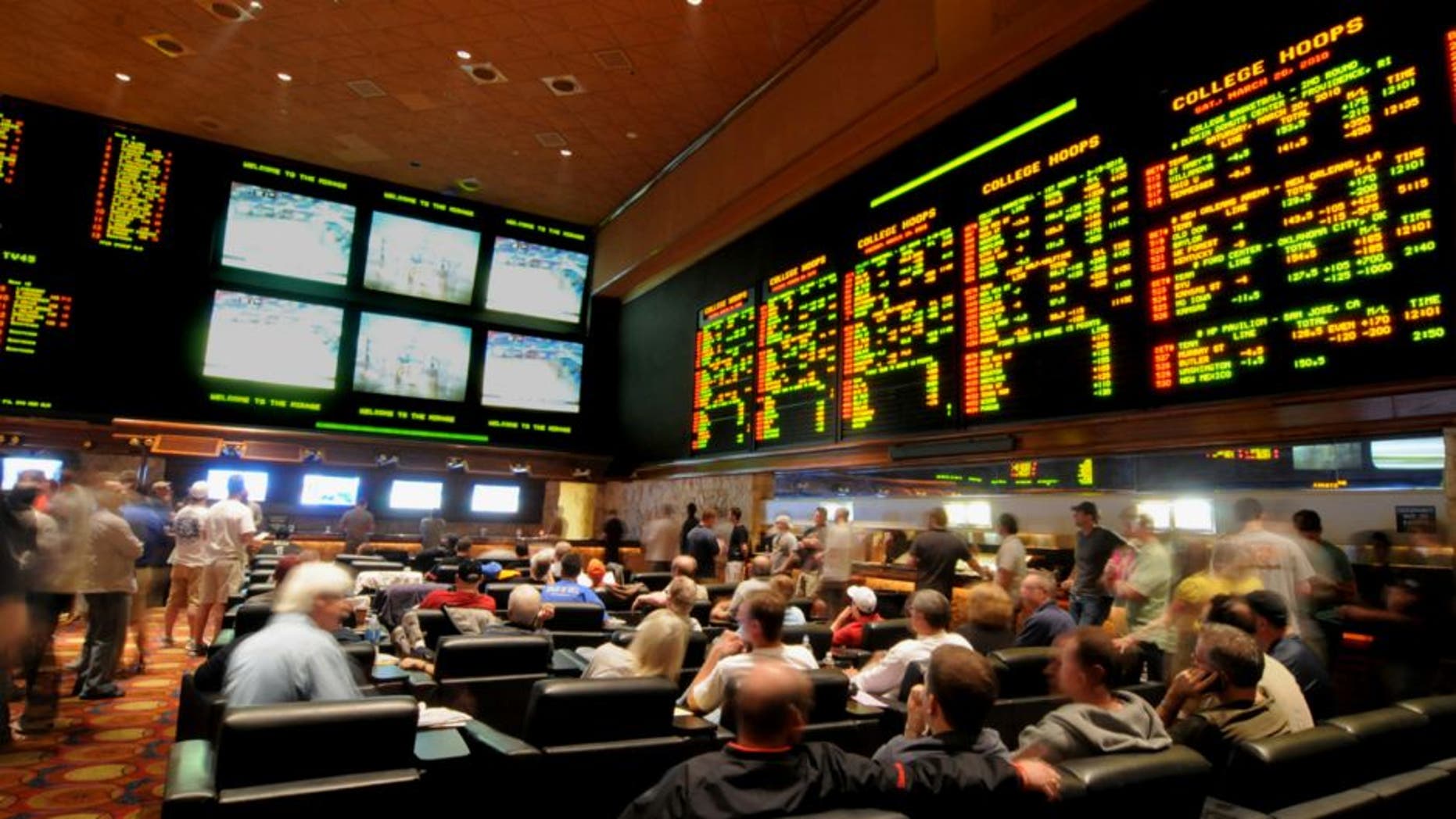 LAS VEGAS - MARCH 19: In this handout provided by the Las Vegas News Bureau, the Mirage Resort Race and Sports Book in Las Vegas is shown crowded with basketball fans during NCAA March Madness Tournament March 19, 2010. in Las Vegas, Nevada. (Photo by Glenn Pinkerton/Las Vegas News Bureau via Getty Images)