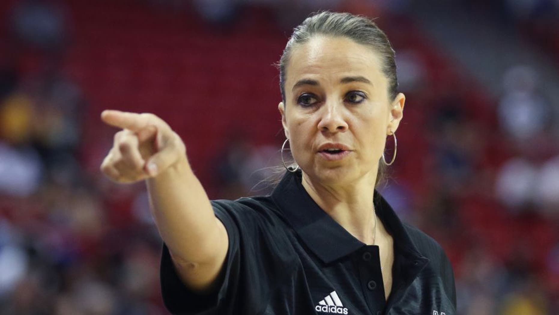 Becky Hammon coaches the San Antonio Spurs during an NBA summer league basketball game against the New York Knicks on Saturday, July 11, 2015, in Las Vegas. (AP Photo/Ronda Churchill)