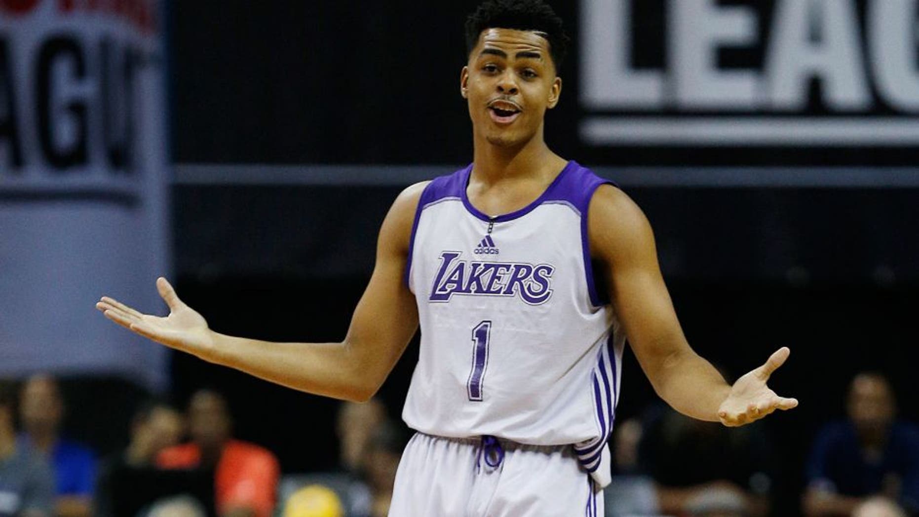 Los Angeles Lakersâ D'Angelo Russell reacts after scoring against the Minnesota Timberwolves during the first half of their NBA summer league basketball game Friday, July 10, 2015, in Las Vegas. (AP Photo/John Locher)