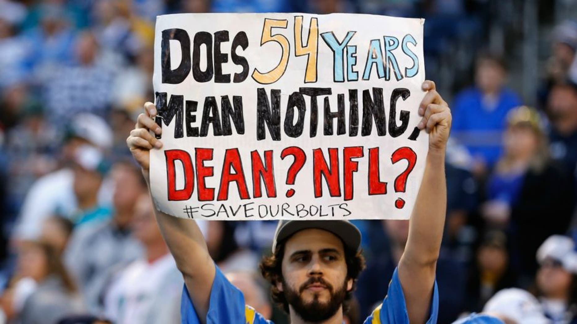 at Qualcomm Stadium on December 20, 2015 in San Diego, California.,SAN DIEGO, CA - DECEMBER 20: A fan holds a sign supporting the San Diego Chargers during a game against the Miami Dolphins at Qualcomm Stadium on December 20, 2015 in San Diego, California. (Photo by Sean M. Haffey/Getty Images)