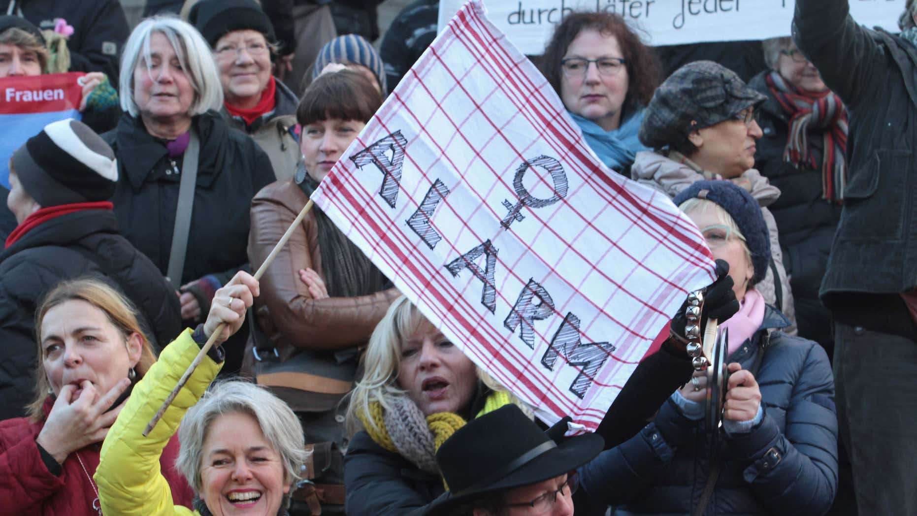 FILE - In this Jan. 9, 2016 file photo participants of a women's flash mob demonstrate against racism and sexism in Cologne, Germany in the aftermath of a string of New Year's Eve sexual assaults and robberies.