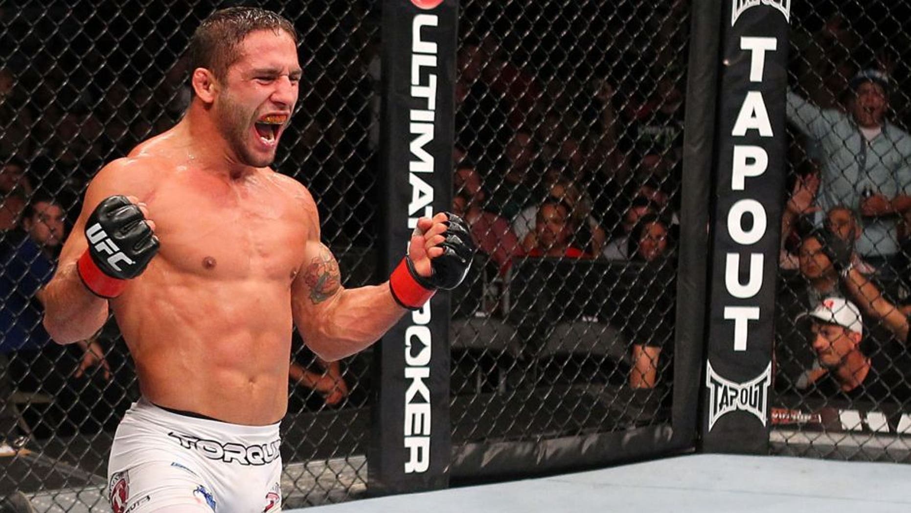 MILWAUKEE, WI - AUGUST 31: (R-L) Chad Mendes celebrates after defeating Clay Guida in their UFC featherweight bout at BMO Harris Bradley Center on August 31, 2013 in Milwaukee, Wisconsin. (Photo by Ed Mulholland/Zuffa LLC/Zuffa LLC via Getty Images)