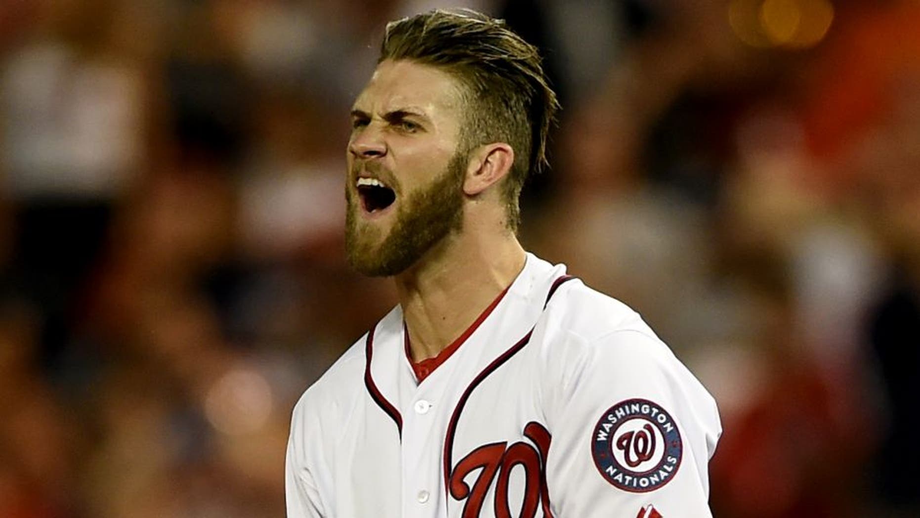 WASHINGTON, DC - AUGUST 05: Bryce Harper #34 of the Washington Nationals reacts after flying out in the sixth inning against the New York Mets at Nationals Park on August 5, 2014 in Washington, DC. The New York Mets won, 6-1. (Photo by Patrick Smith/Getty Images)