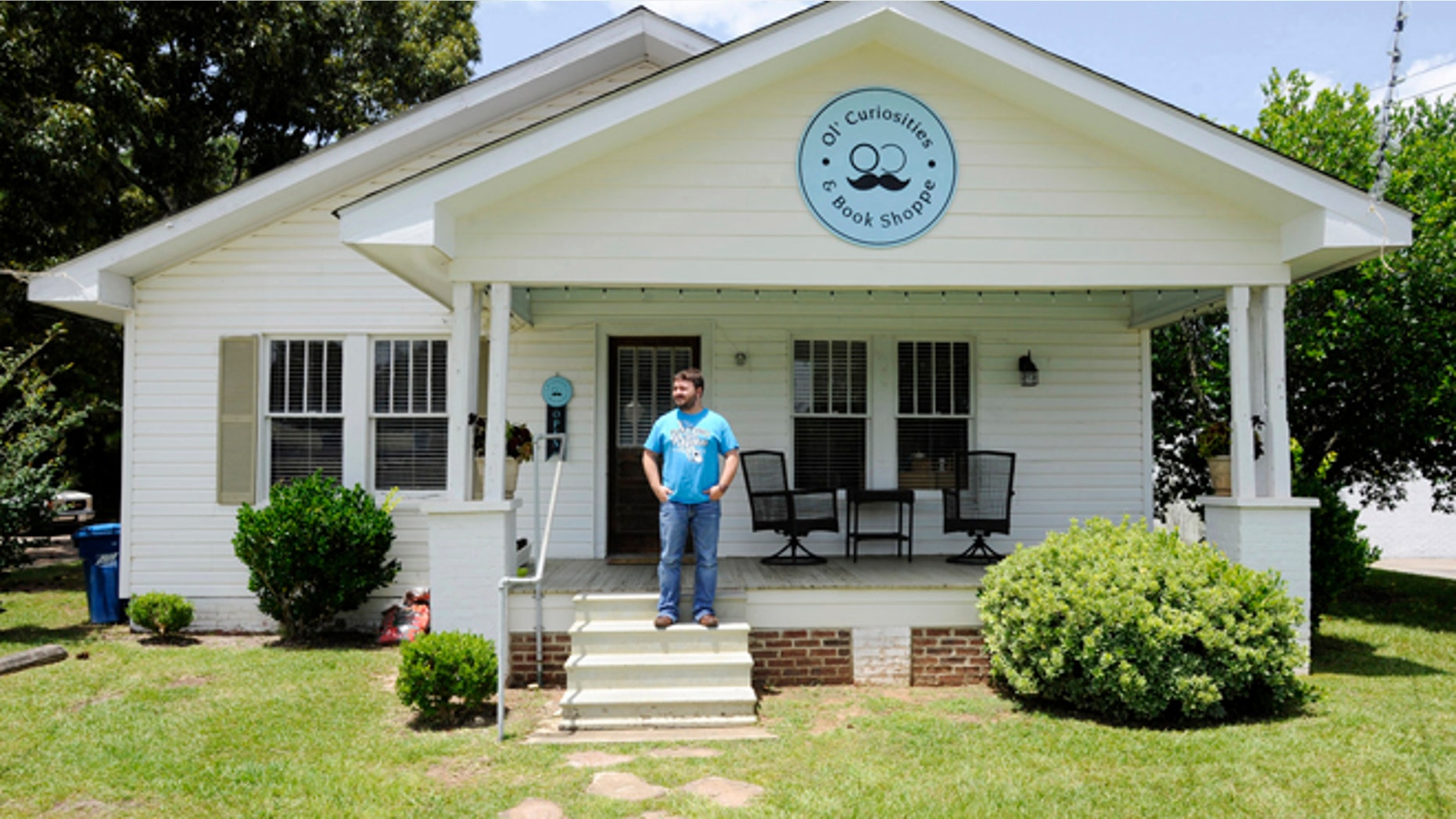 July 8, 2015: Spencer Madrie poses outside his store, Ol' Curiosities & Book Shoppe, in Monroeville, Ala.