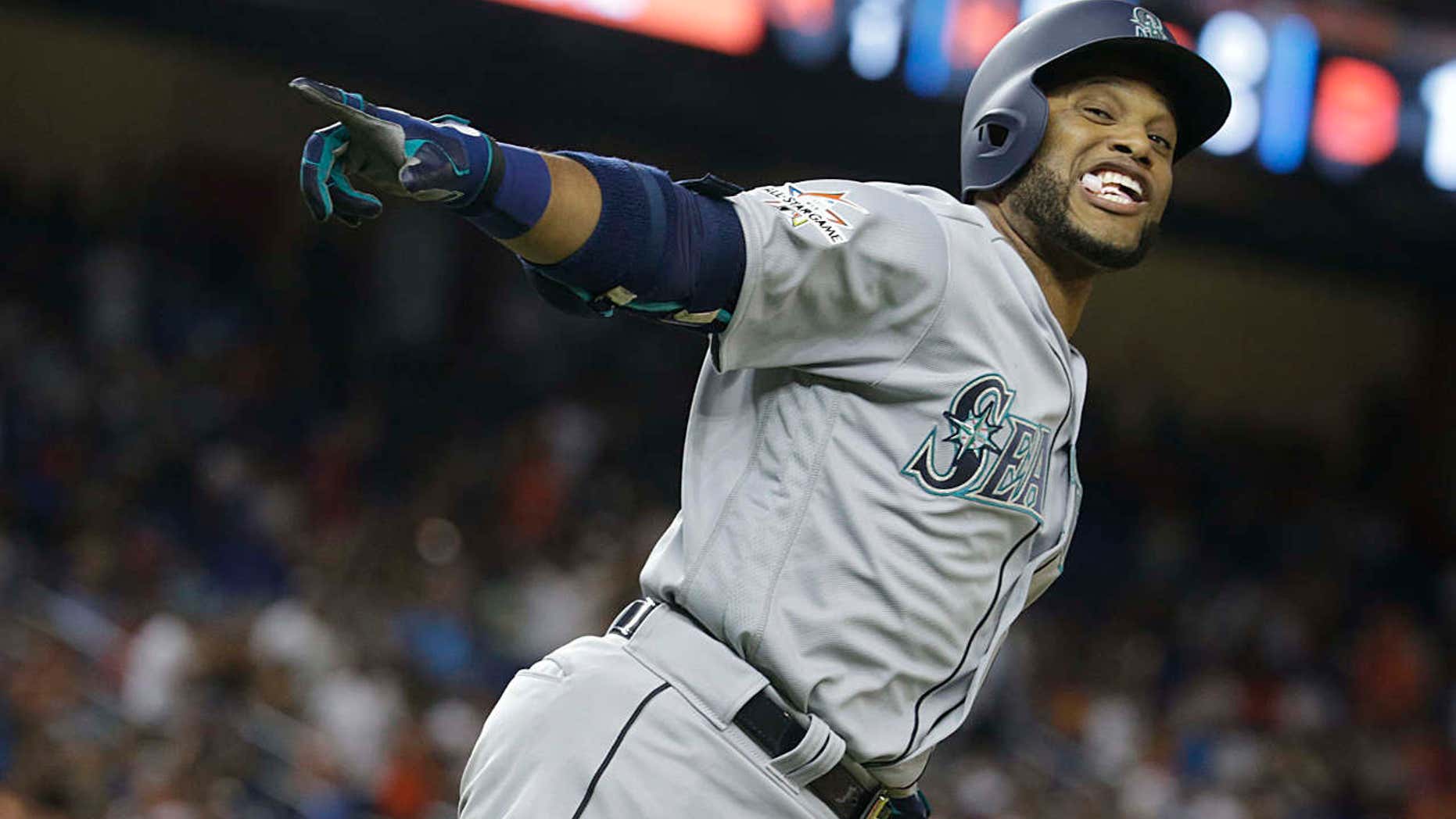 American League's Seattle Mariners Robinson Cano (22), rounds the bases after hitting a homerun in the tenth inning, during the MLB baseball All-Star Game, Tuesday, July 11, 2017, in Miami.