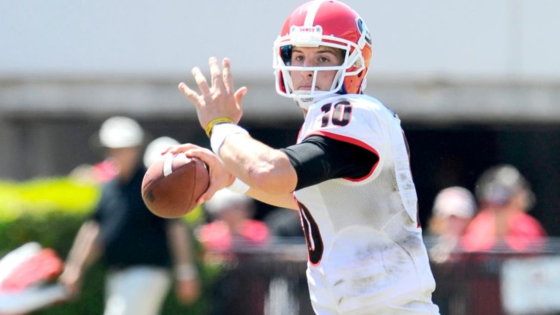 Apr 12, 2014; Athens, GA, USA; Georgia Bulldogs quarterback Faton Bauta (10) throws the ball during the second half of the Georgia Spring Game at Sanford Stadium. The Red team won 27-24. Mandatory Credit: Dale Zanine-USA TODAY Sports