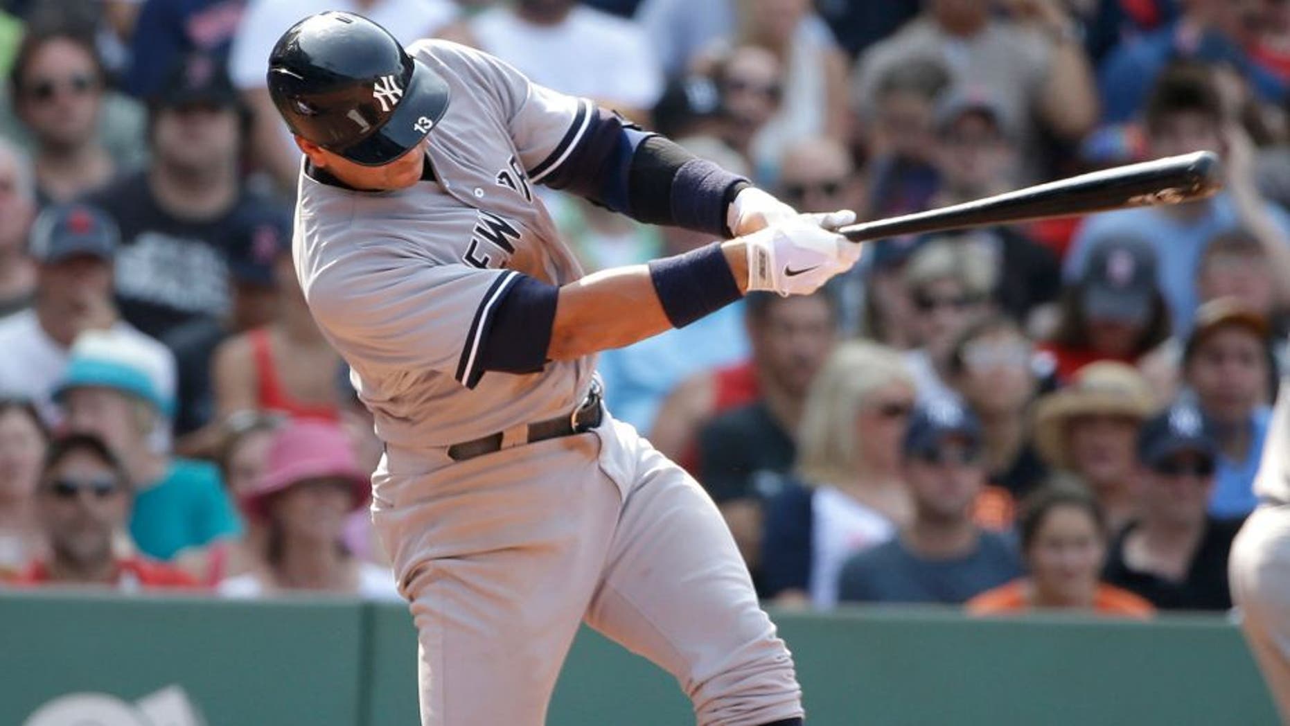 New York Yankees' Alex Rodriguez lines into a double play on a pitch by Boston Red Sox's Alexi Ogando in the seventh inning of a baseball game at Fenway Park, Sunday, July 12, 2015, in Boston. The Yankees won 8-6. (AP Photo/Steven Senne)