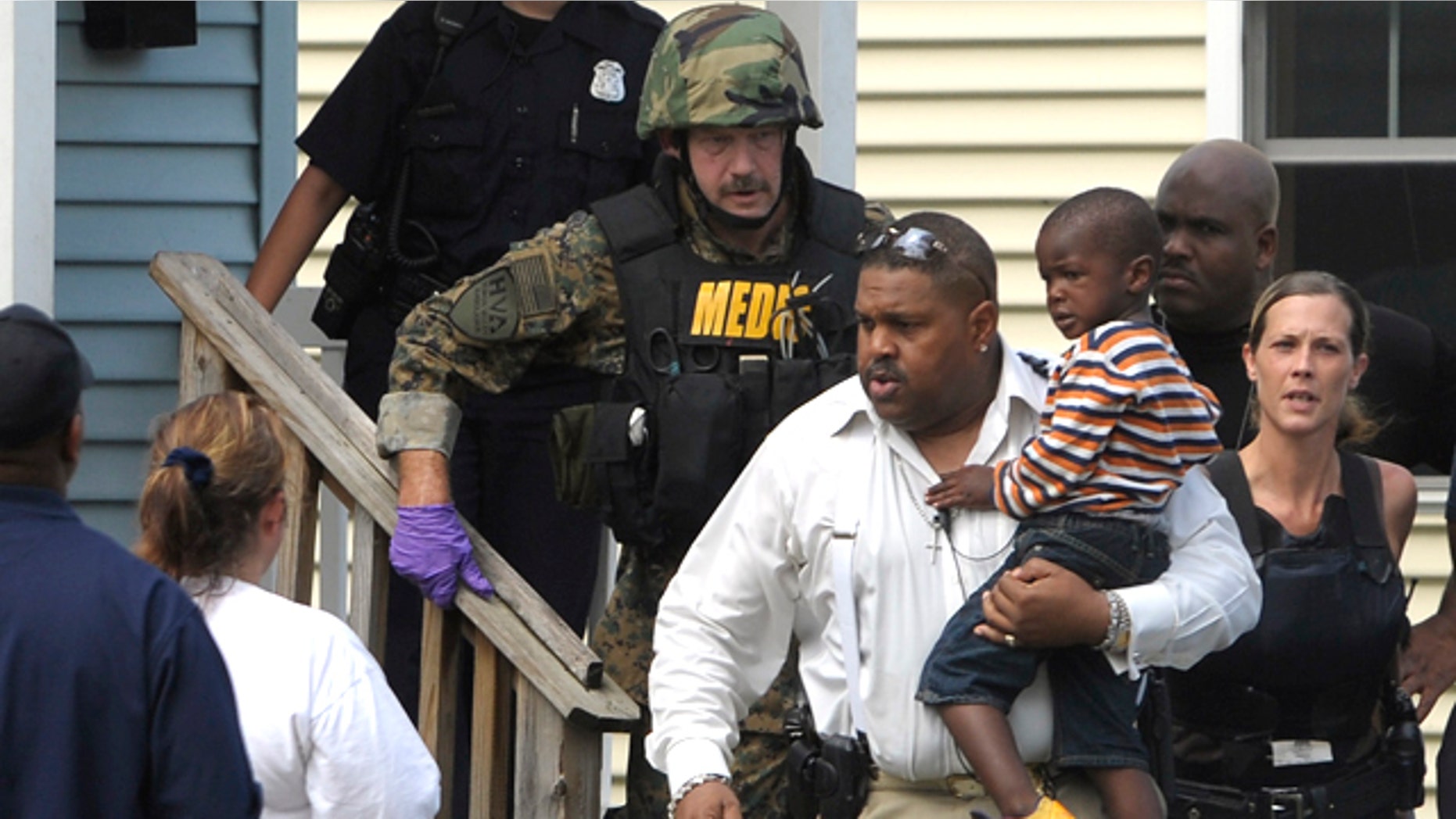 July 12: Police remove a child from a home in Highland Park, Mich., where a woman reportedly held her 3-year-old grandson hostage for several hours.