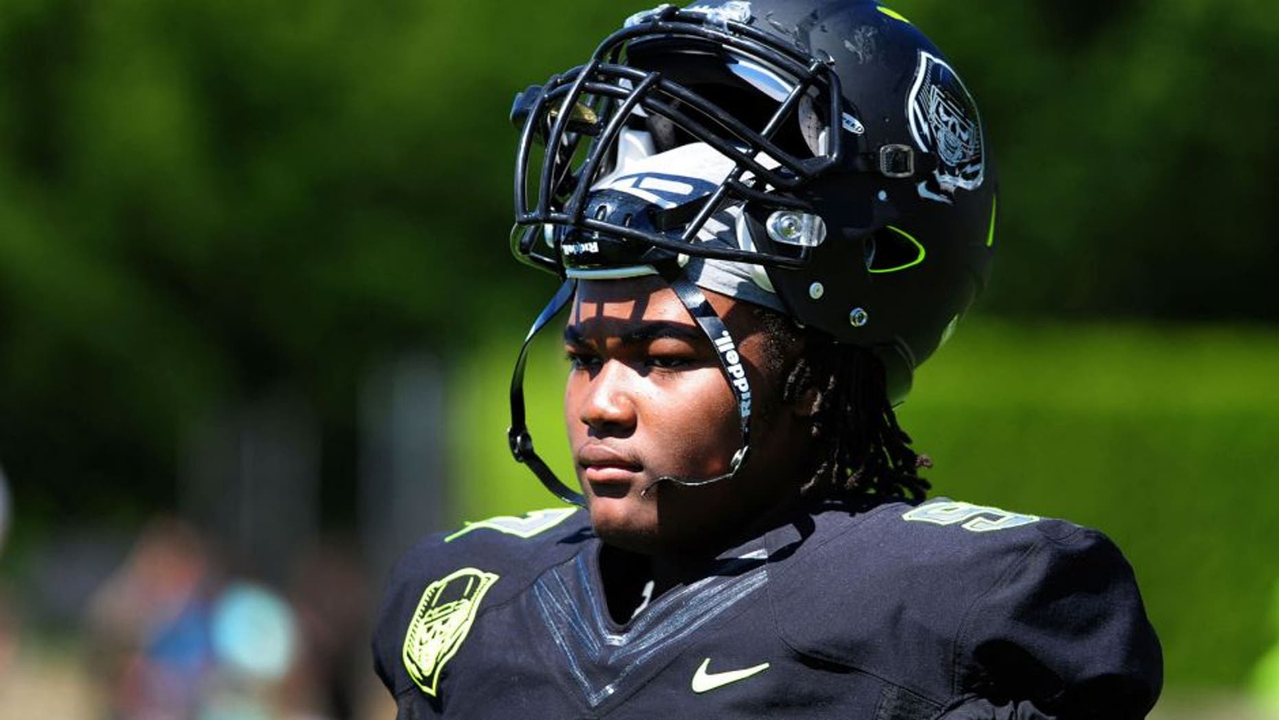 Jul 10, 2014; Beaverton, OR, USA; Defensive lineman Rashan Gary (97) looks on from the sidelines during Nike Football ' The Opening' at Nike World Headquarters. Mandatory Credit: Steve Dykes-USA TODAY Sports