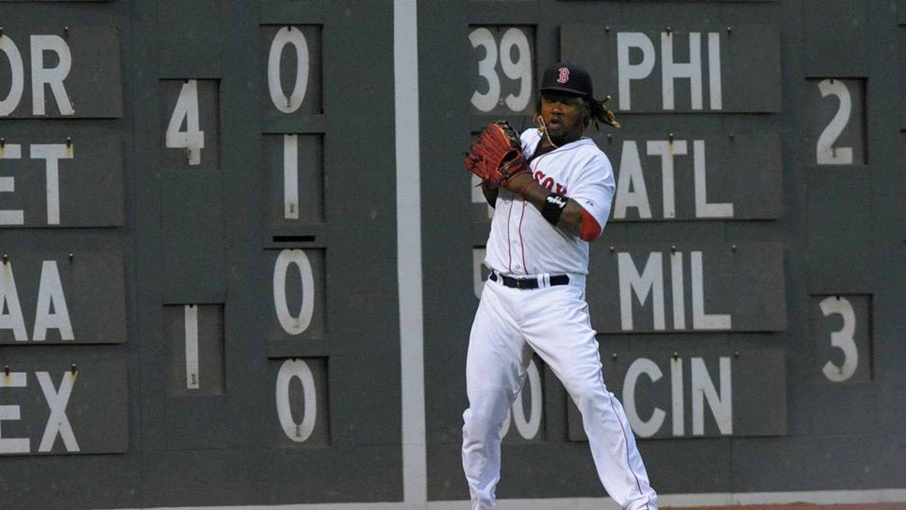 Jul 3, 2015; Boston, MA, USA; Boston Red Sox left fielder Hanley Ramirez (13) mishandles the ball during the fourth inning against the Houston Astros at Fenway Park. Mandatory Credit: Bob DeChiara-USA TODAY Sports