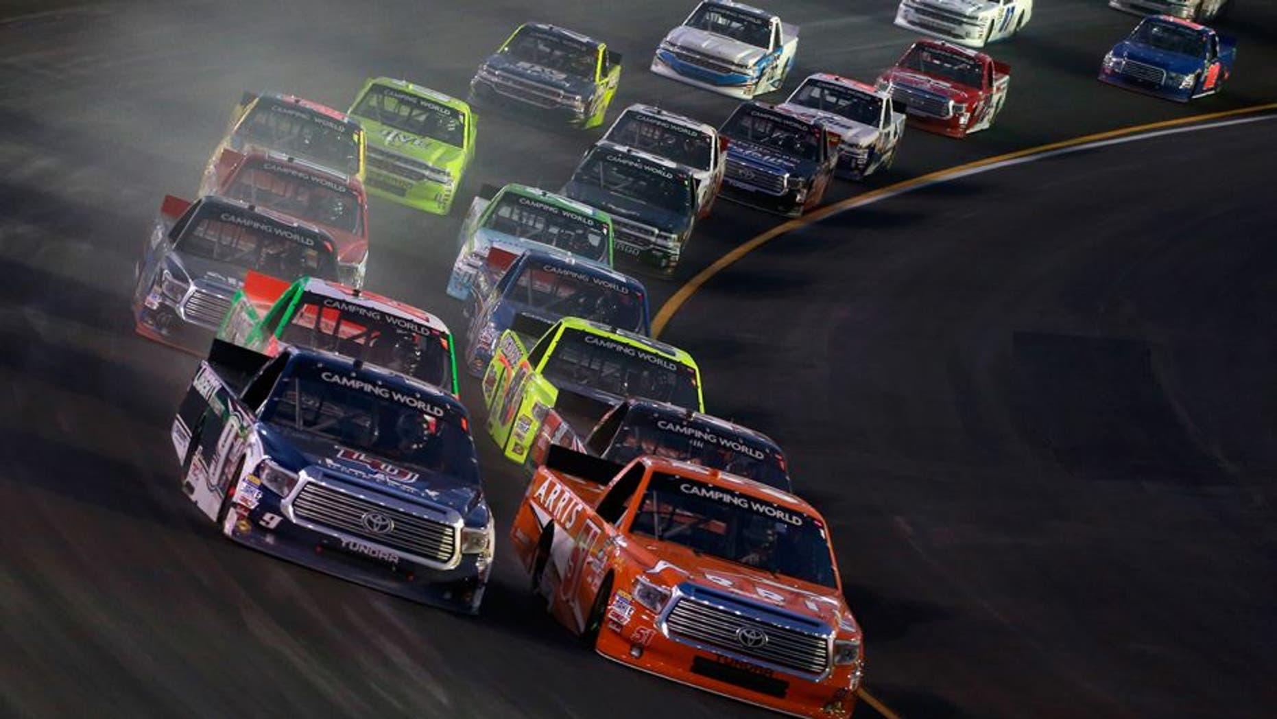 SPARTA, KY - JULY 07: Daniel Suarez, driver of the #51 ARRIS Toyota, and William Byron, driver of the #9 Liberty University Toyota, lead the field in a restart during the NASCAR Camping World Truck Series Buckle Up In Your Truck 225 at Kentucky Speedway on July 7, 2016 in Sparta, Kentucky. (Photo by Matt Sullivan/Getty Images)