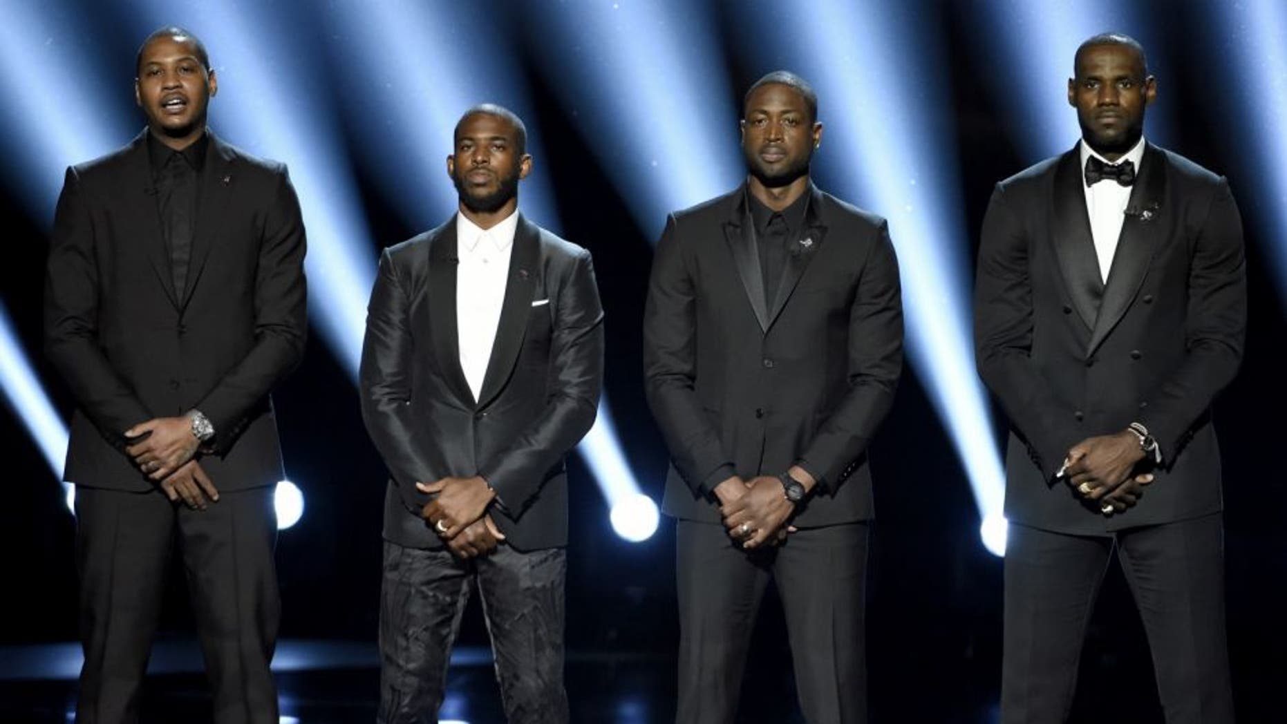 NBA basketball players Carmelo Anthony, from left, Chris Paul, Dwyane Wade and LeBron James speak on stage at the ESPY Awards at the Microsoft Theater on Wednesday, July 13, 2016, in Los Angeles. (Photo by Chris Pizzello/Invision/AP)