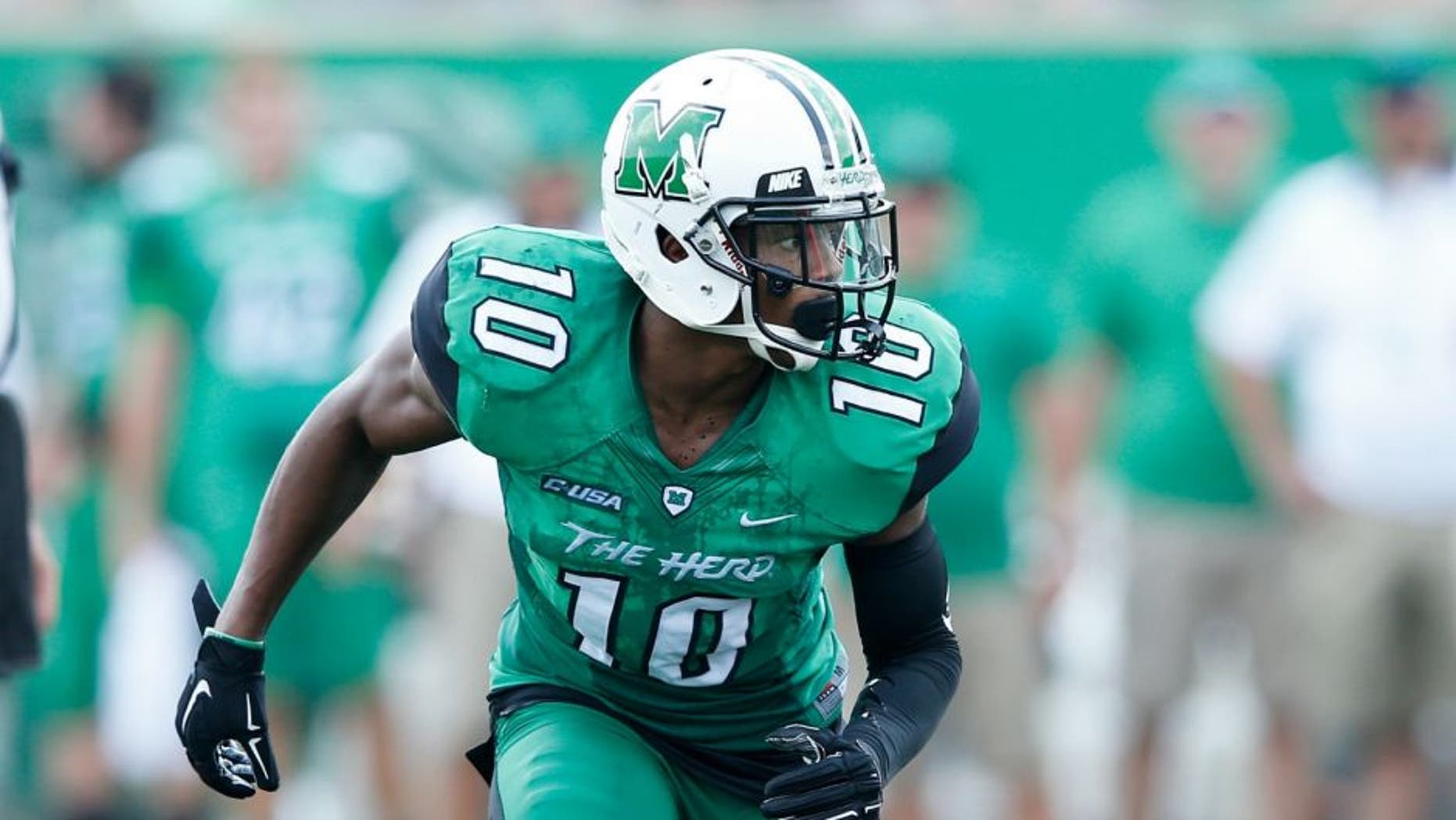 HUNTINGTON, WV - SEPTEMBER 6: Corey Tindal #10 of the Marshall Thundering Herd in action against the Purdue Boilermakers at Joan C. Edwards Stadium on September 6, 2015 in Huntington, West Virginia. Marshall defeated Purdue 41-31. (Photo by Joe Robbins/Getty Images)