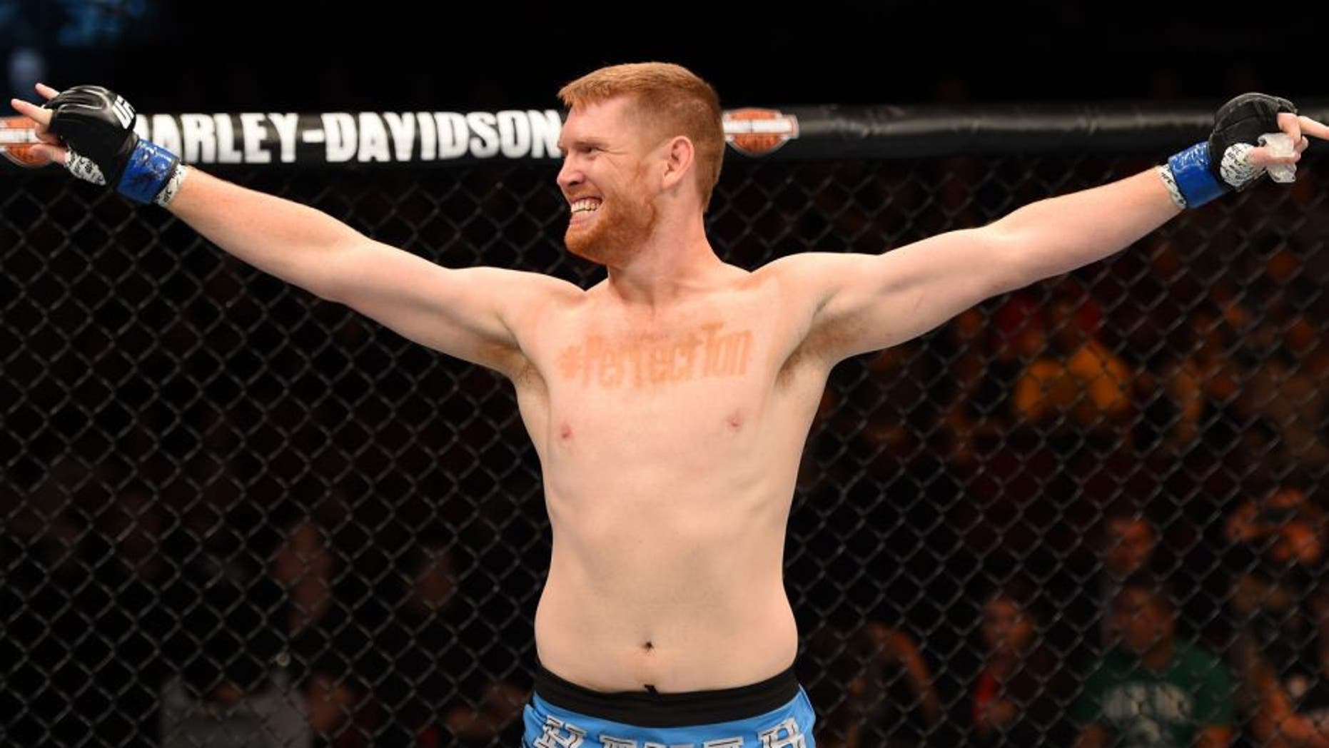 ADELAIDE, AUSTRALIA - MAY 10: Sam Alvey celebrates his knock out victory over Daniel Kelly in their middleweight bout during the UFC Fight Night event at the Adelaide Entertainment Centre on May 10, 2015 in Adelaide, Australia. (Photo by Josh Hedges/Zuffa LLC/Zuffa LLC via Getty Images)