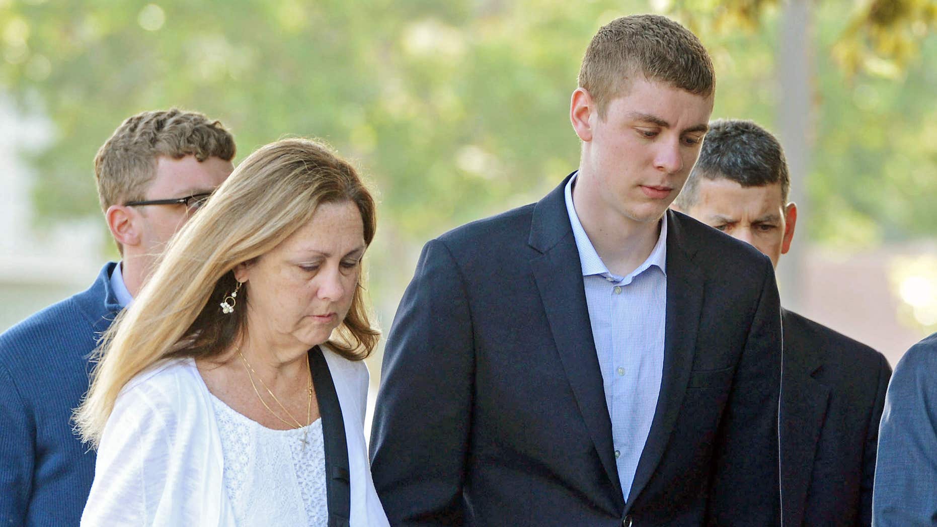 FILE - In this June 2, 2016 file photo, Brock Turner, 20, right, makes his way into the Santa Clara Superior Courthouse in Palo.