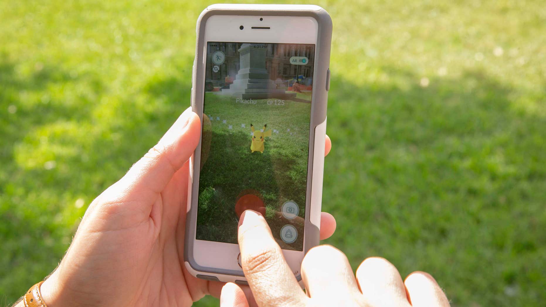 July 11, 2016: Sarah Boutwell plays the augmented-reality smartphone game Pokémon Go at the Capitol in Austin, Texas