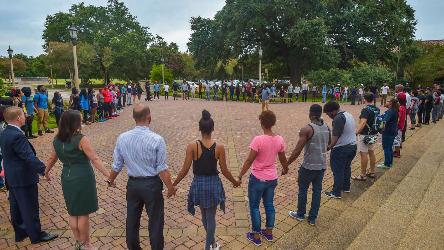 July 11, 2016: People pray during Prayer Vigil organized by Myron Smothers at Memorial Tower on the Louisiana State University campus in Baton Rouge, La.