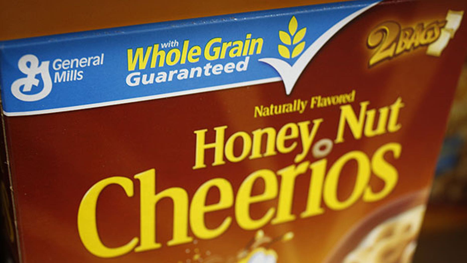 In this Dec. 8, 2009 photo, a box of Honey Nut Cheerios is seen on display at Costco in Mountain View, Calif. The nation's largest food companies say they will cut back on marketing unhealthier foods to children, proposing their own set of advertising standards after rejecting similar guidelines proposed by the federal government.