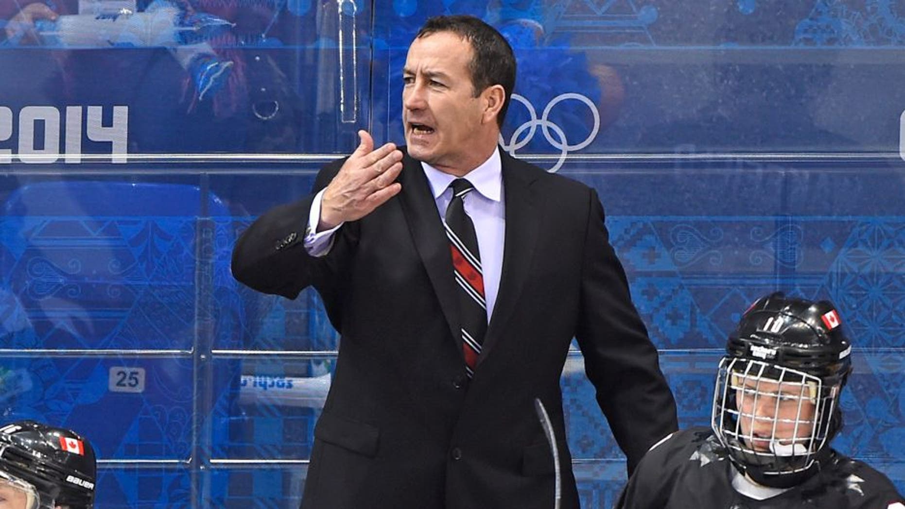 Canada's head coach Kevin Dineen reacts during the Women's Ice Hockey Group A match Canada vs Switzerland at the Shayba Arena during the Sochi Winter Olympics on February 8, 2014. Team Canada won with the score 5-0. AFP PHOTO / JONATHAN NACKSTRAND (Photo credit should read JONATHAN NACKSTRAND/AFP/Getty Images)