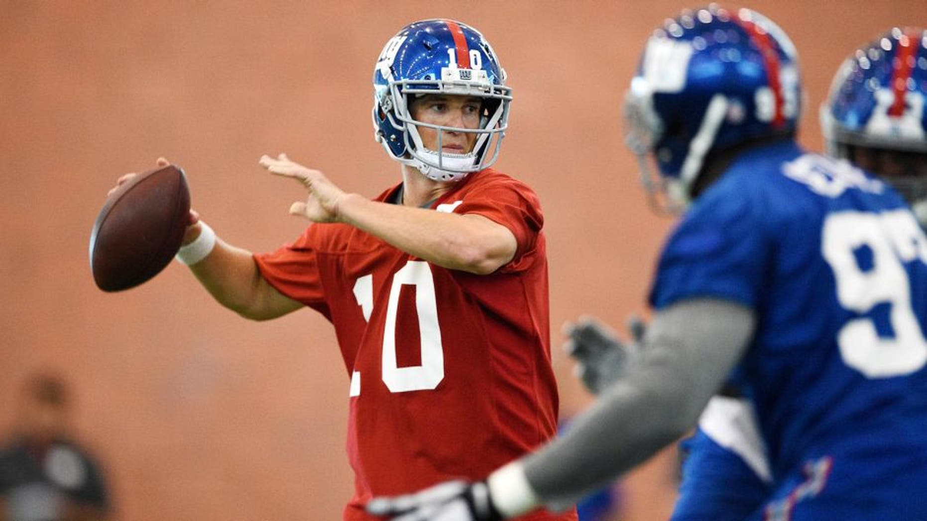 Jun 16, 2015; East Rutherford, NJ, USA; New York Giants quarterback Eli Manning (10) drops back to pass during minicamp at Quest Diagnostics Training Center. Mandatory Credit: Steven Ryan-USA TODAY Sports
