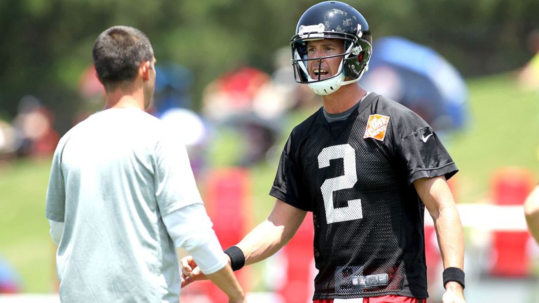 Jun 17, 2015; Atlanta, GA, USA; Atlanta Falcons quarterback Matt Ryan (2) talks to offensive coordinator Kyle Shanahan during minicamp at Falcons Training Facility. Mandatory Credit: Brett Davis-USA TODAY Sports